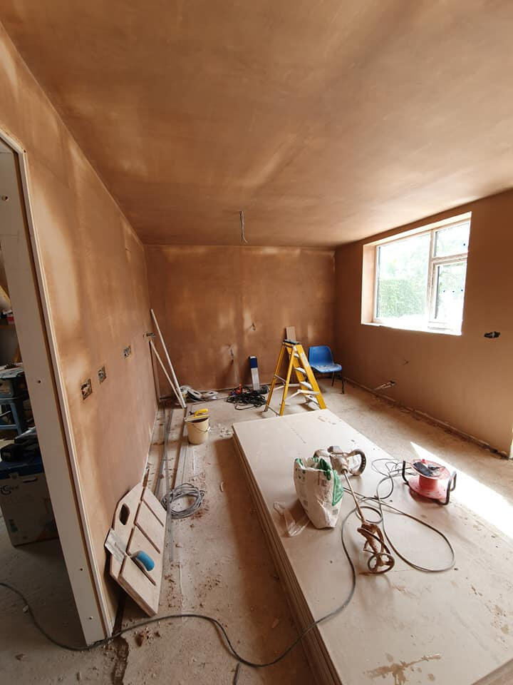 Fresh brown coat plaster ready for skim finish